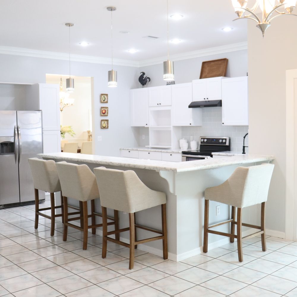 Kitchen Spraying in Kidbrooke — clean edges cut in around trim and sockets