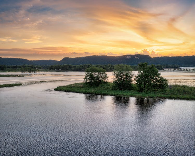 Landscape Of A Lake And Mountains At Sunset 