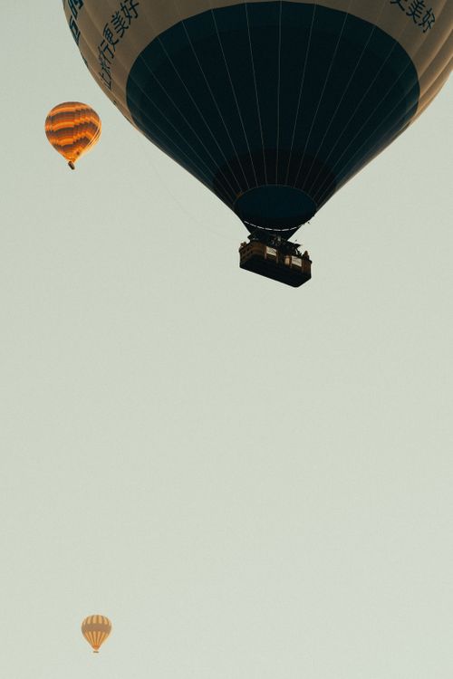 Free Hot air balloons ascending against a clear sky, evoking adventure and freedom. Stock Photo