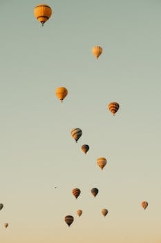A captivating view of hot air balloons adorning the sky during sunrise, offering a sense of adventure.