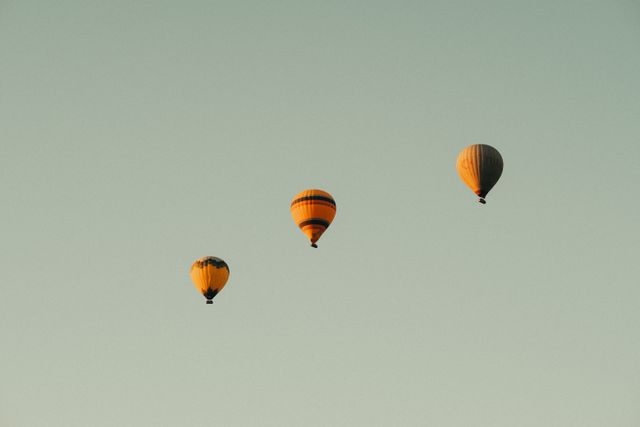 Hot air balloons drifting at dawn — photo by Sami Aksu on Pexels