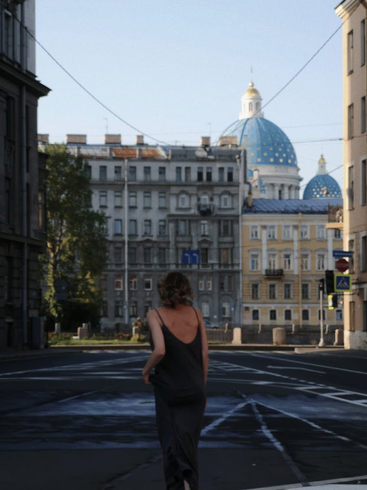 Woman Running Down A City Street