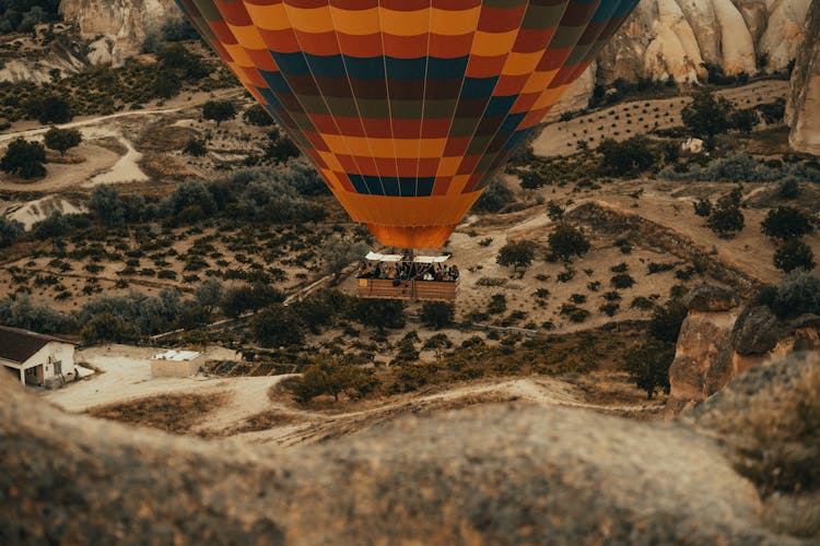 People On The Gondola Of An Airborne Hot Air Balloon