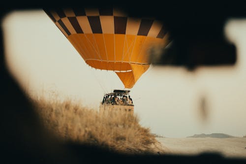 Free Yellow Hot Air Balloon on Brown Grass Field Stock Photo