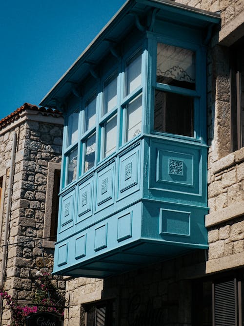 Blue Wooden Window on Stone Wall