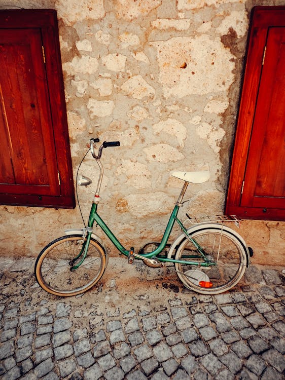 Bicycle Leaning on a Stone Wall
