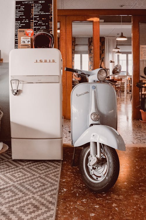 Piaggio Vespa Standing inside of a Bar