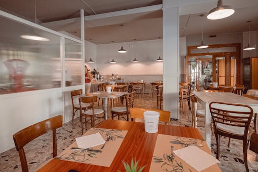 Warm and inviting diner interior featuring wooden tables and chairs in a cozy atmosphere.