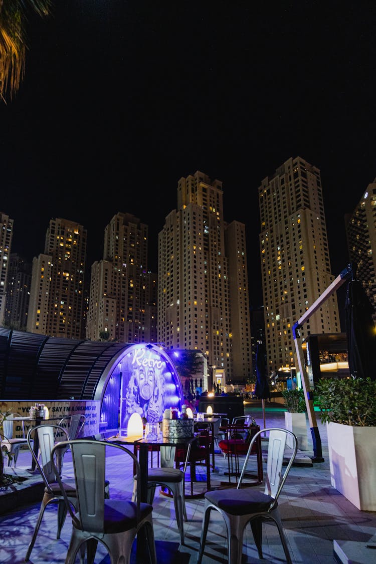 Outdoor Terrace Near Skyscrapers In City Downtown At Night