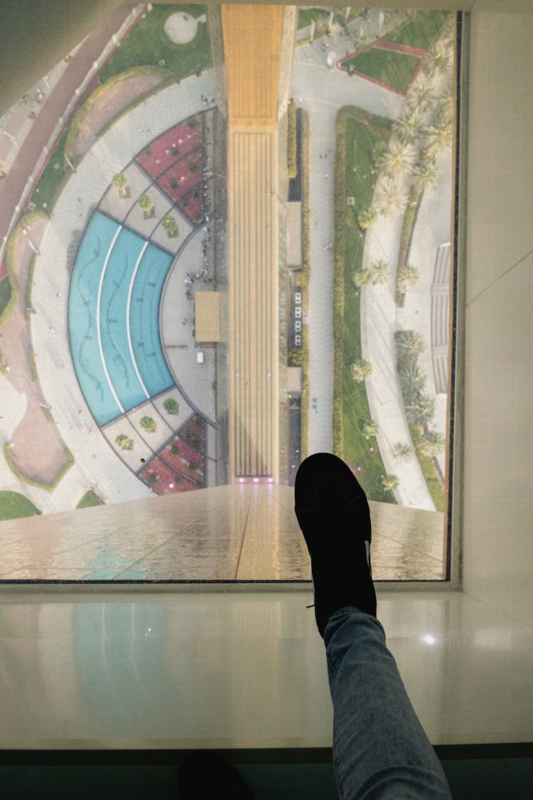 Leg On Glass Floor