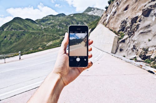 Close-Up Shot of a Person Holding a Smartphone