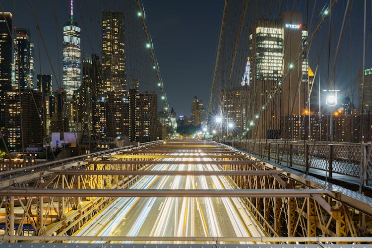 View Of Traffic On The Brooklyn Bridge In Lower Manhattan During Night Time