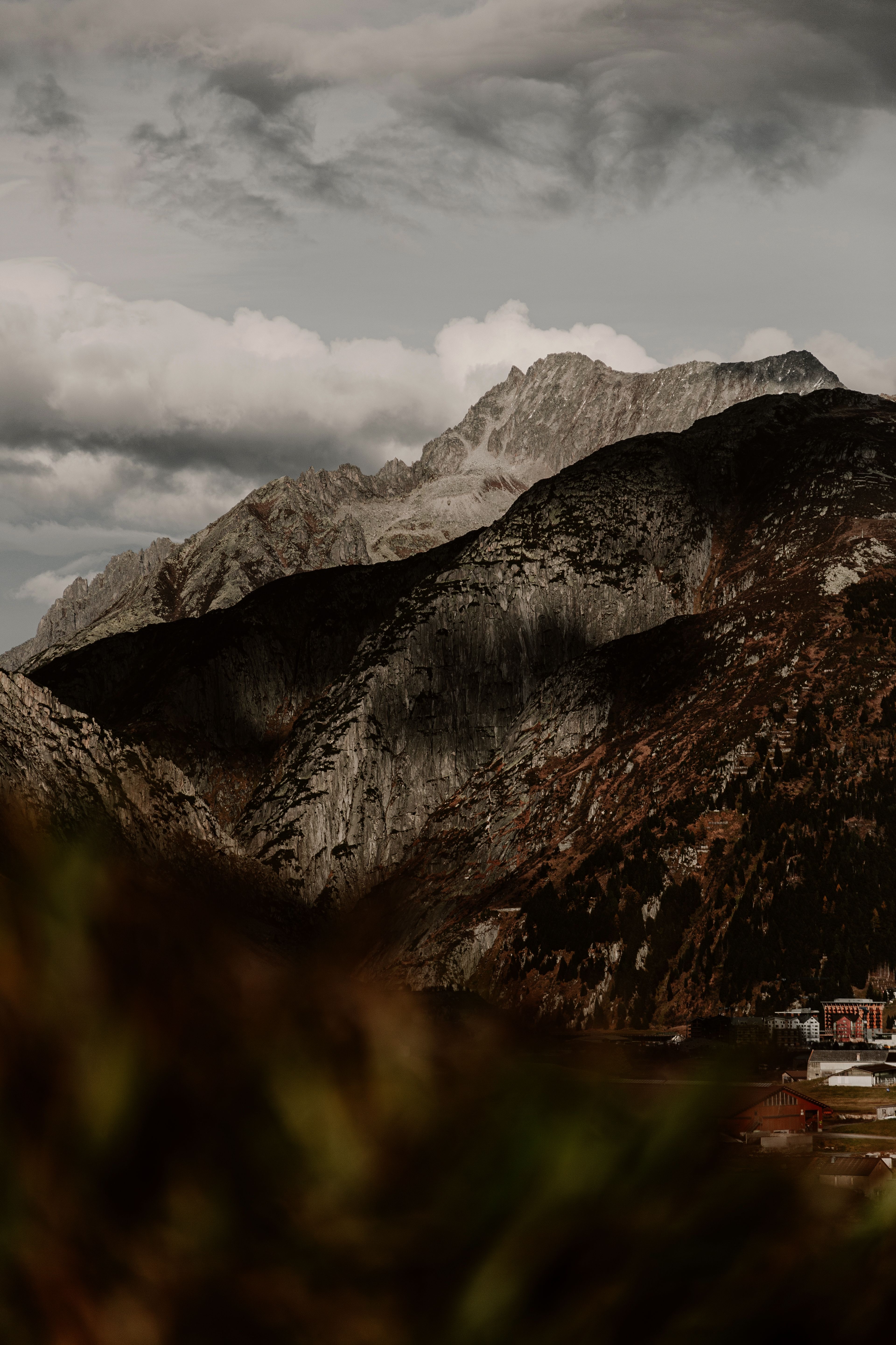 Brown and White Mountain Near Body of Water · Free Stock Photo