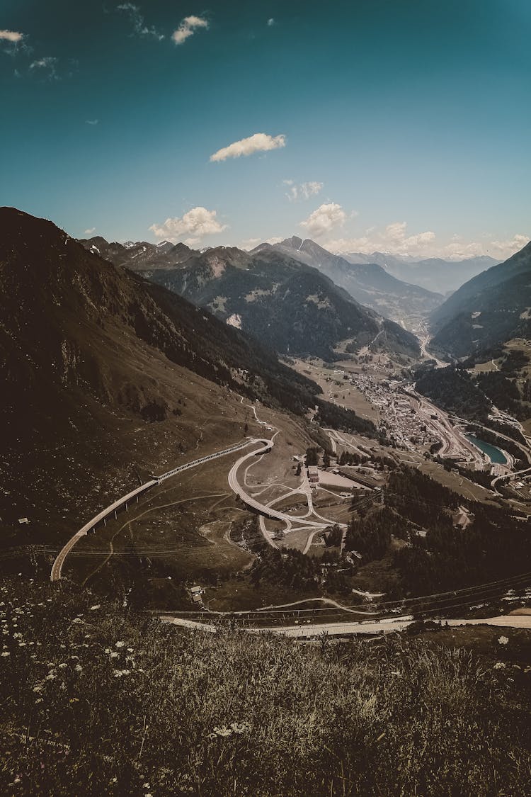 Aerial View Of Road Going Through Valley