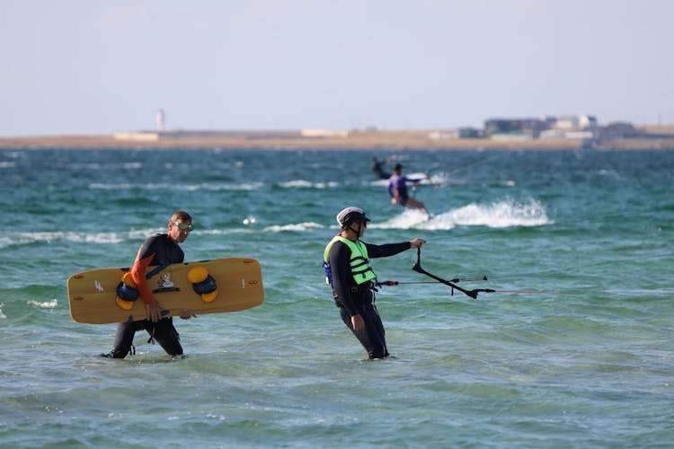 Men Surfing In The Sea