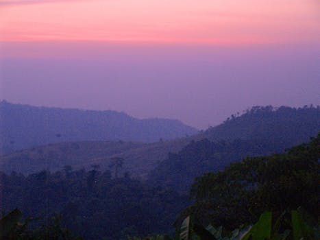 Breathtaking pink sunrise over the misty mountains of Khao Kho, Thailand.