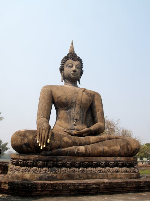 Free Brown Sitting Budha Statue Under Blue Sky Stock Photo