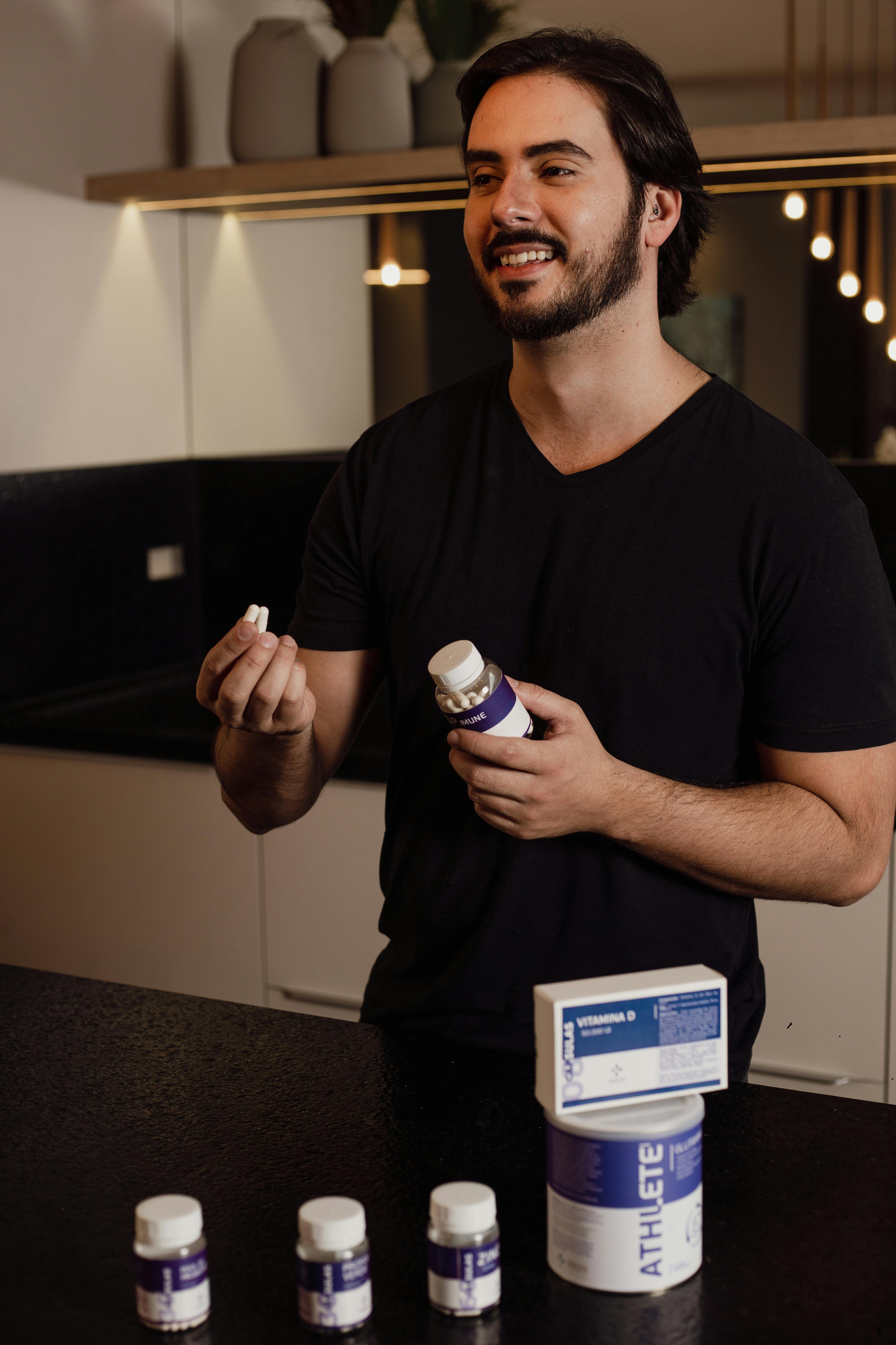 man taking supplements