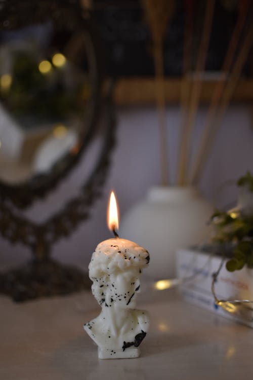 Close-Up Shot of a Lit Candle 
