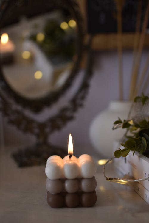 Free Lit Candles  over a Table Stock Photo