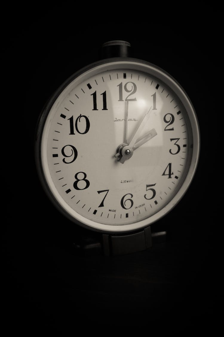 A Close Up Shot Of An Analog Clock