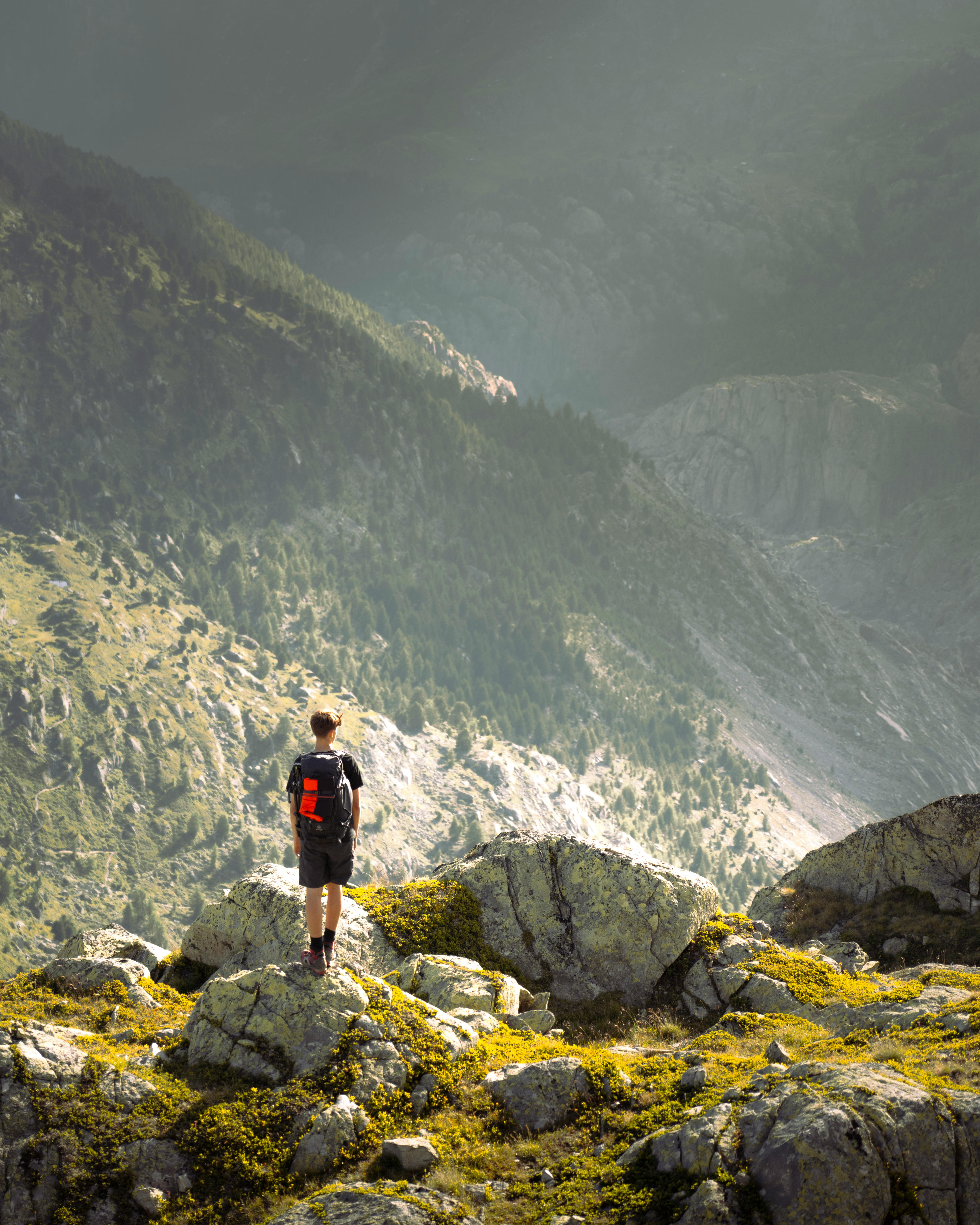A lone hiker takes in breathtaking alpine scenery at Bettmeralp, Switzerland.