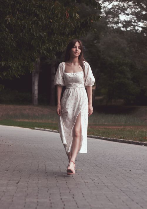 Free Elegant woman in a white dress strolling through a serene park in Uman', Ukraine. Stock Photo