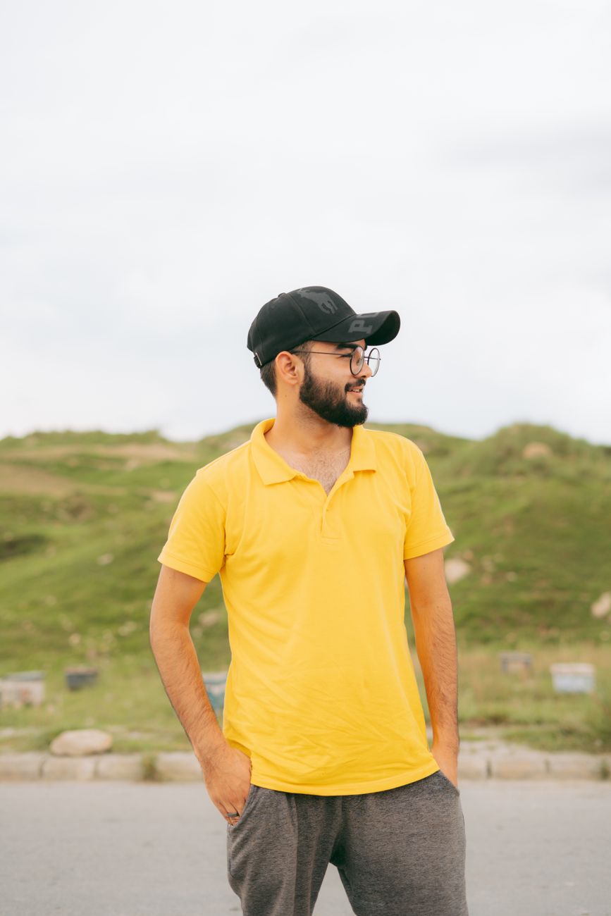 Yellow Polo Cap Stands Casually