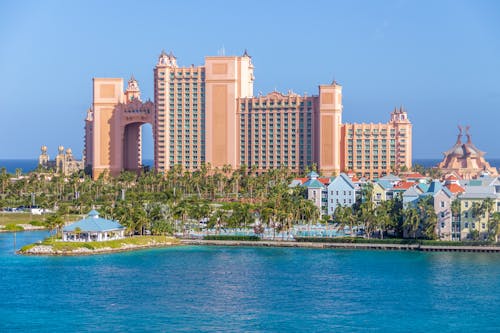 City Building Near Body of Water under Blue Sky