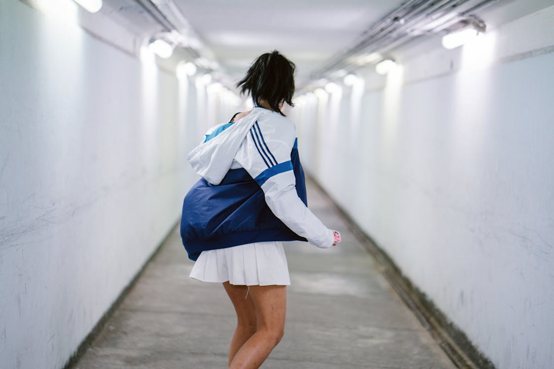 Free Woman in White Jacket at the Hallway Stock Photo