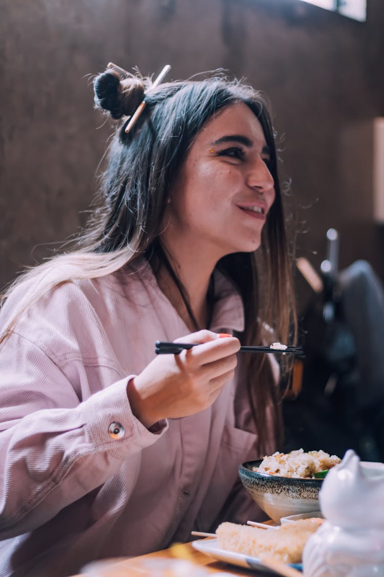 Woman Eating In Restaurant