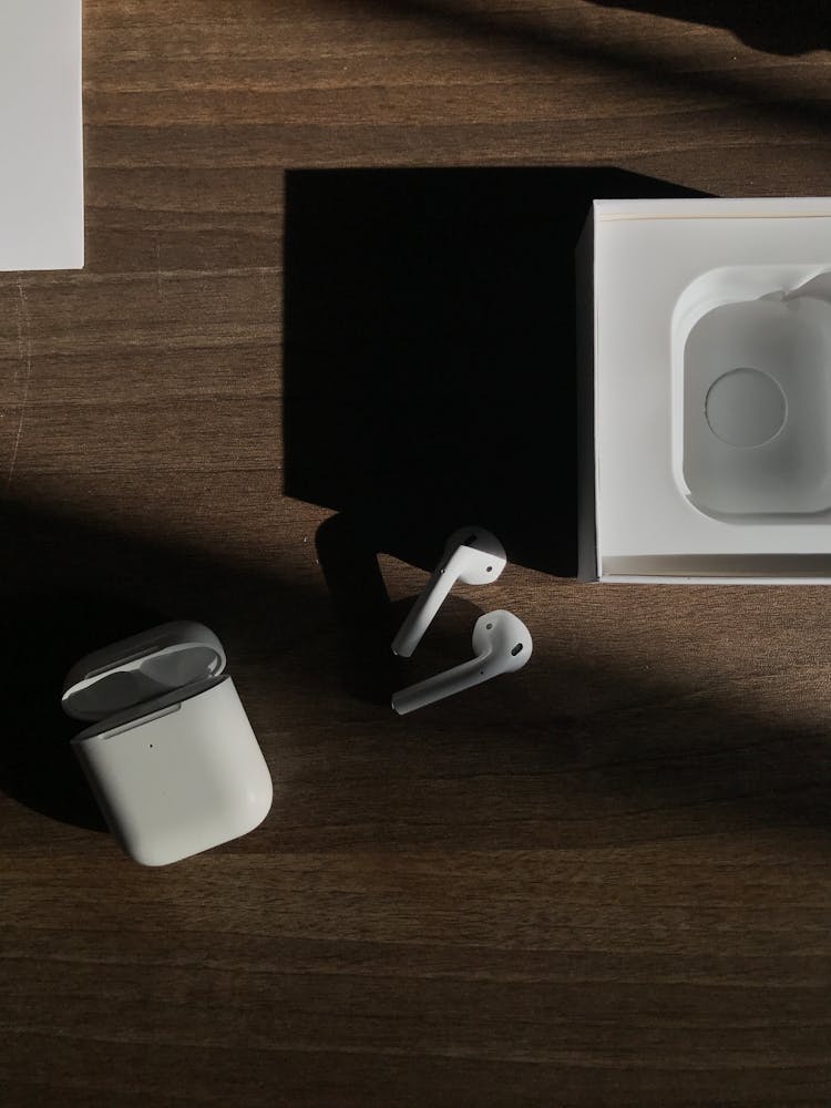 Apple AirPods On Wooden Surface