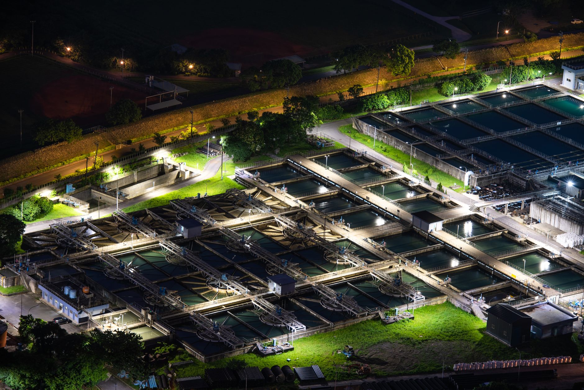 An aerial night view of a lit water treatment facility in Sanxia, Taiwan.