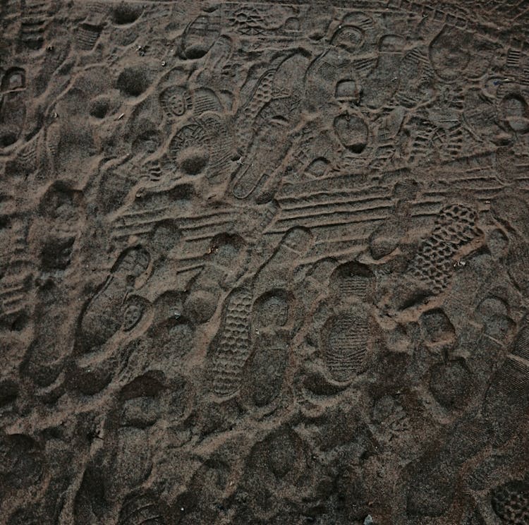 Close-up Of Footsteps On Sand