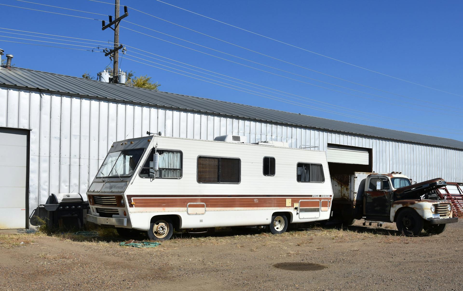 Vintage Mobile RV Parked on Dirt Road