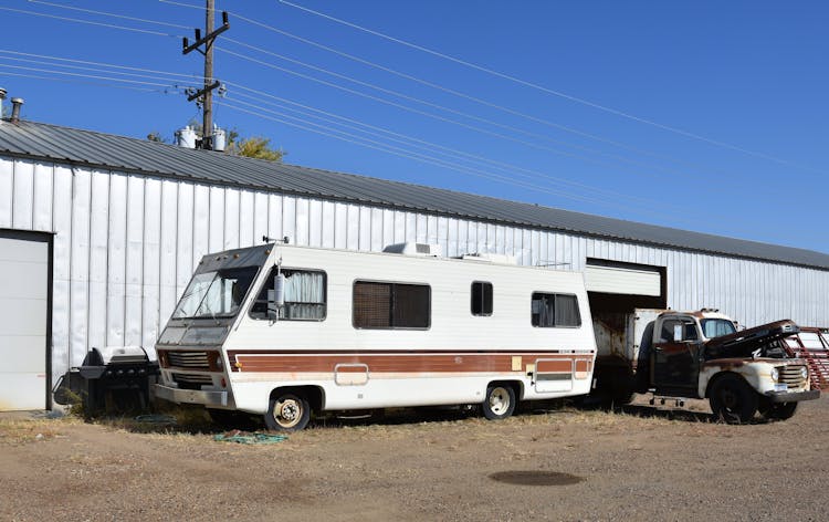 Vintage Mobile RV Parked On Dirt Road