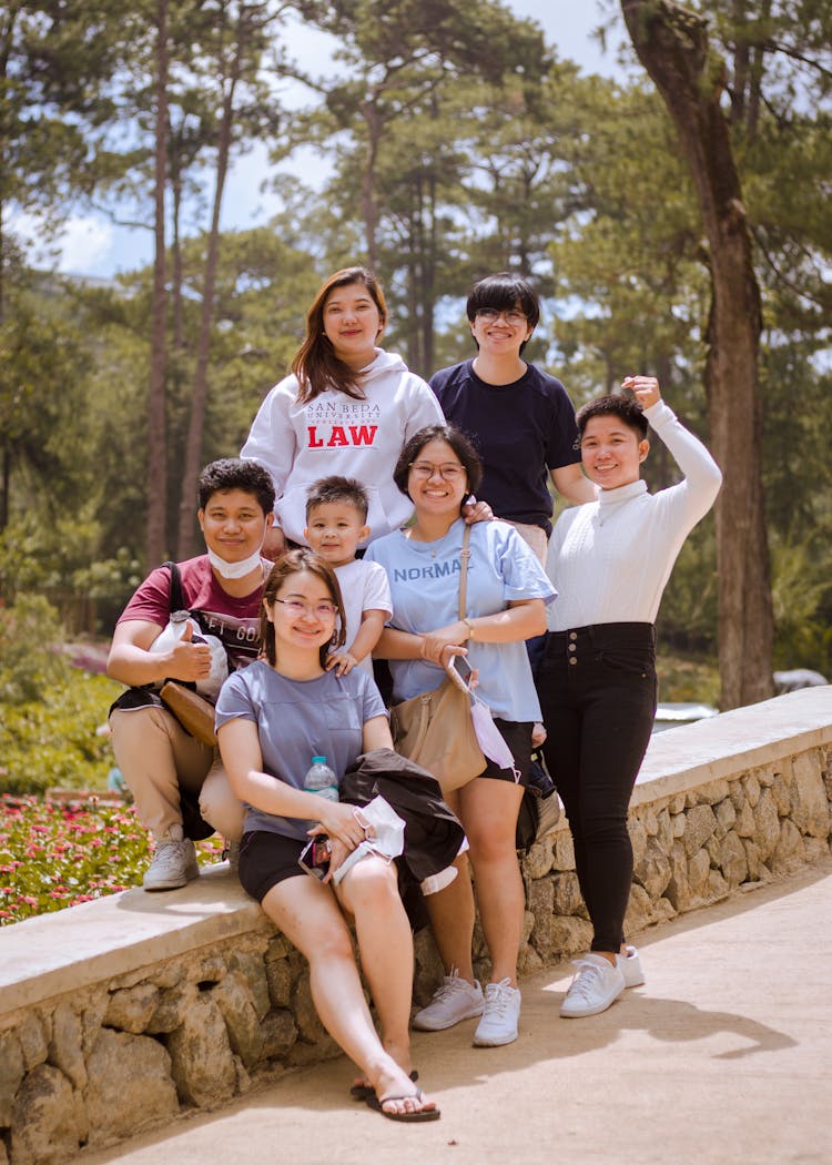 A Family Smiling At The Camera