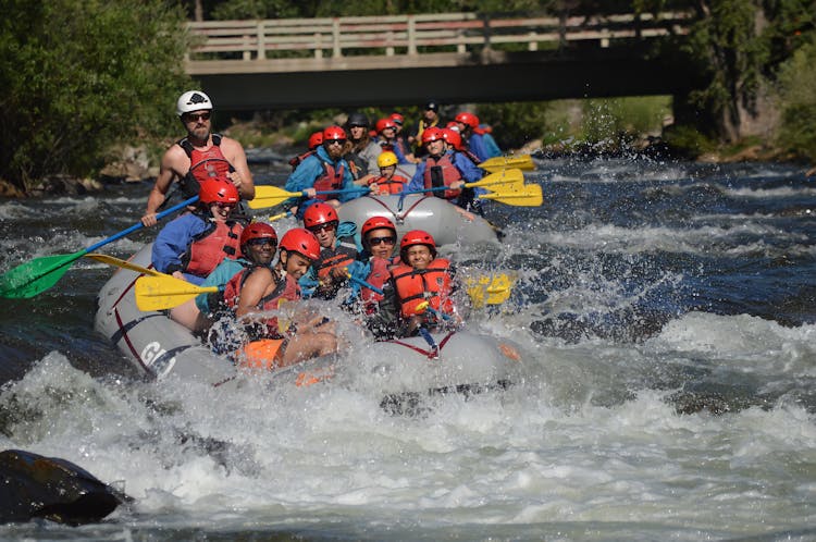 People Riding On Inflatable Raft