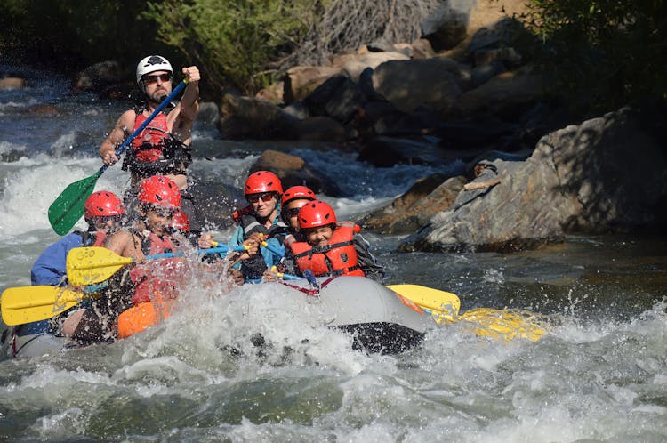 People Riding On Inflatable Raft