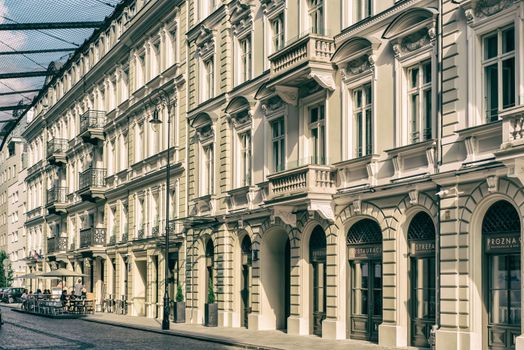 Charming historic buildings with elegant facades and balconies in Warsaw, Poland, perfect for architectural exploration.