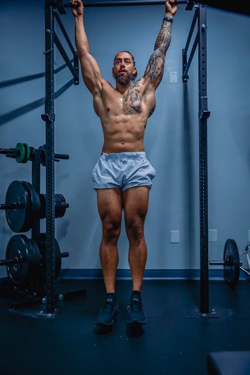 woman doing pull-ups exercise - Stock Image - Everypixel