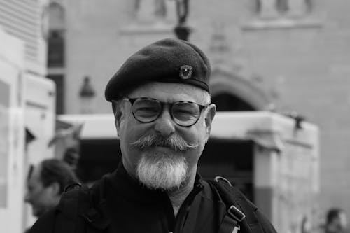 Grayscale Portrait of a Man with a Beret