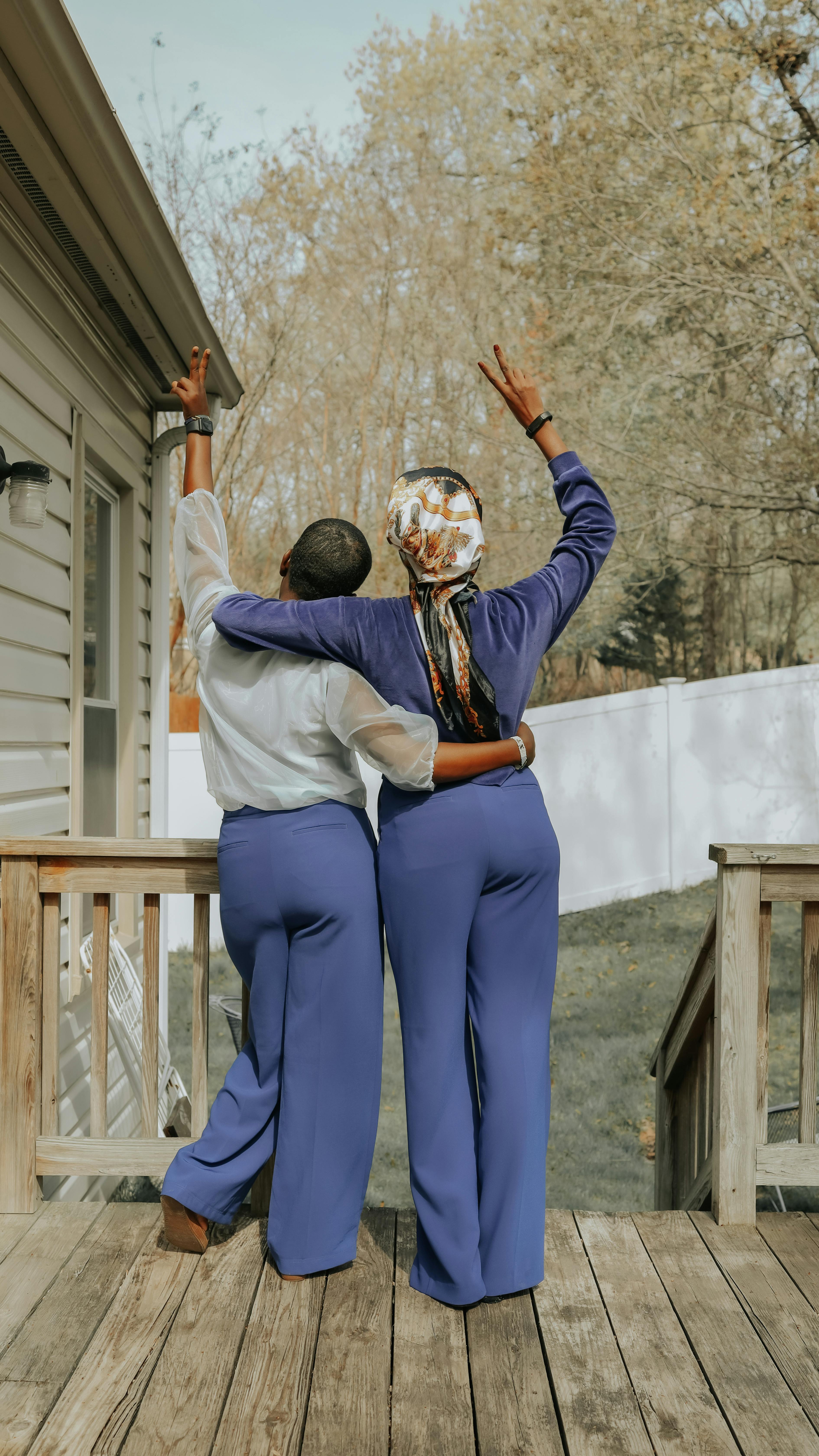 back view shot of fashionable women posing at the camera