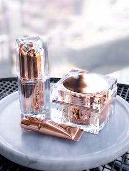 Stylish skincare products showcased on a marble tray, perfect for health and beauty themes.