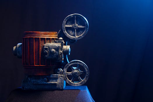 A classic vintage film projector in a studio setup with dramatic lighting.
