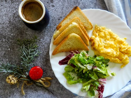 Free Toasts and Scrambled Eggs on a Plate Stock Photo