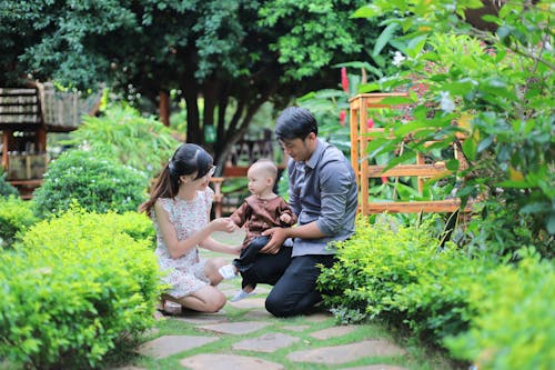 Portrait of a Kneeling Family in the Garden