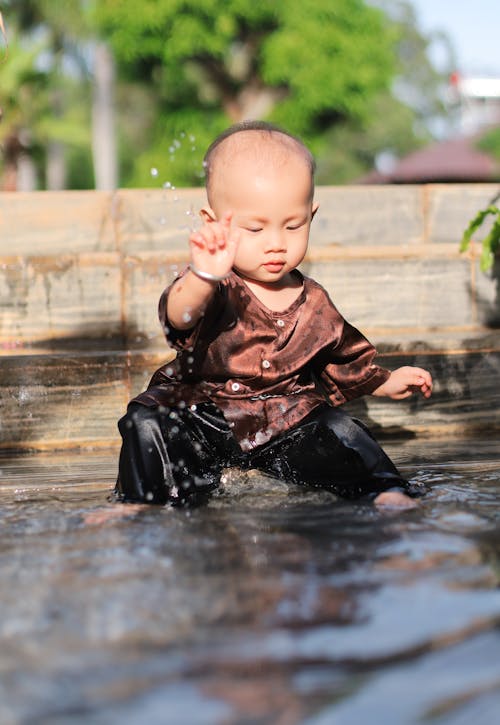 Cute Child Playing in the Water