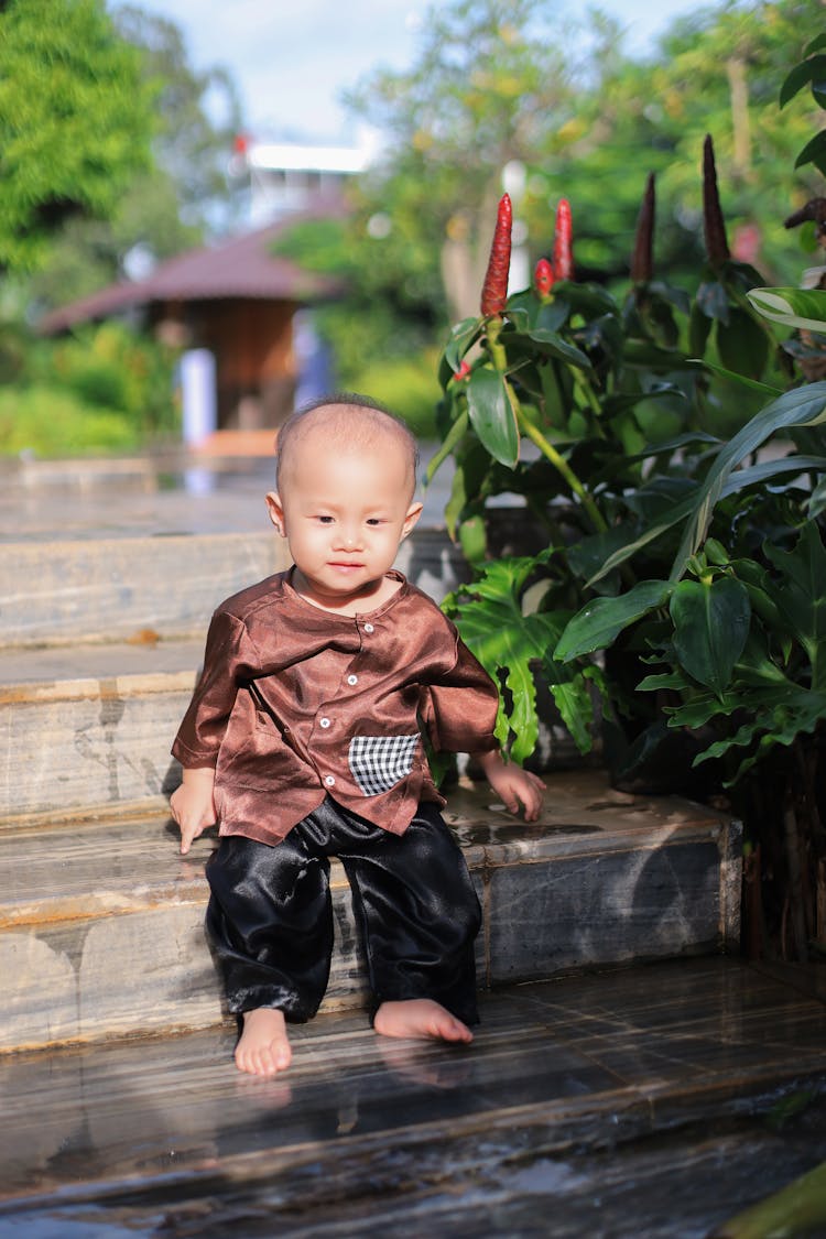 Toddler Sitting On Steps