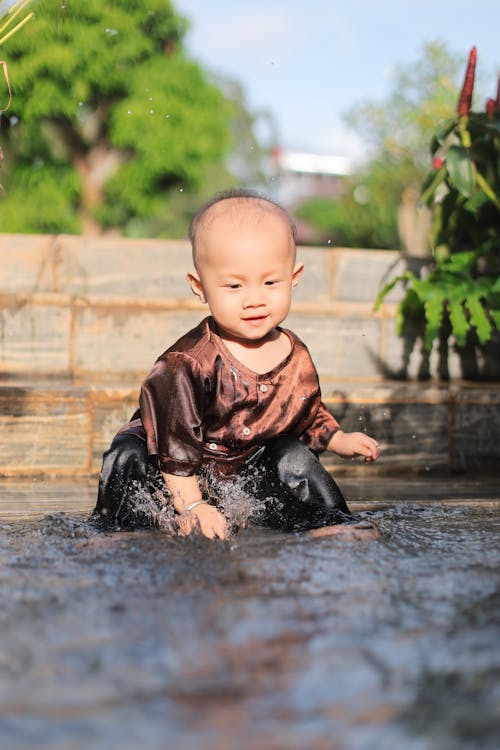 Cute Child Playing in the Water